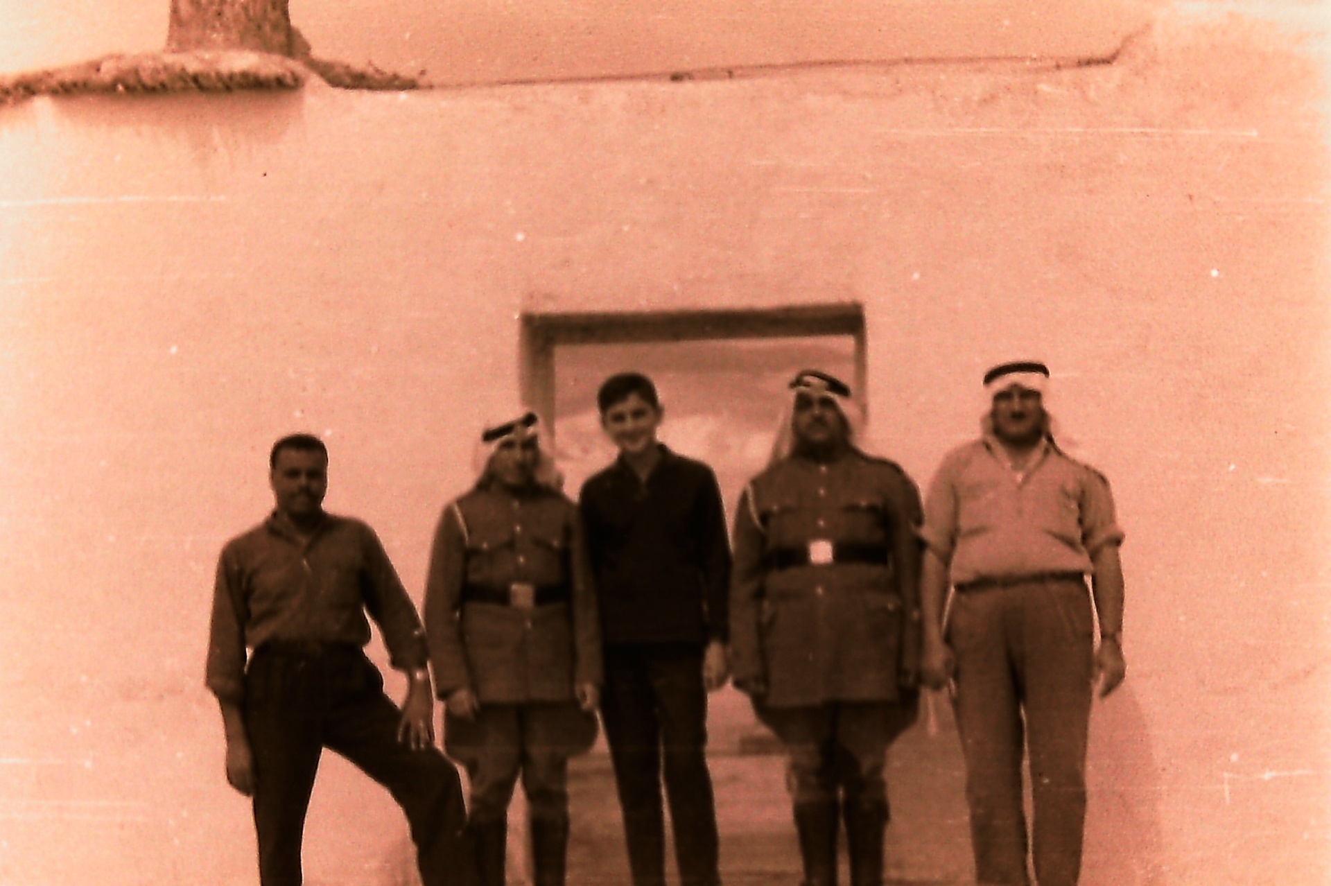 Teenage Samsam Al-Nimer with the Jordanian post guards stationed in Fasayel.