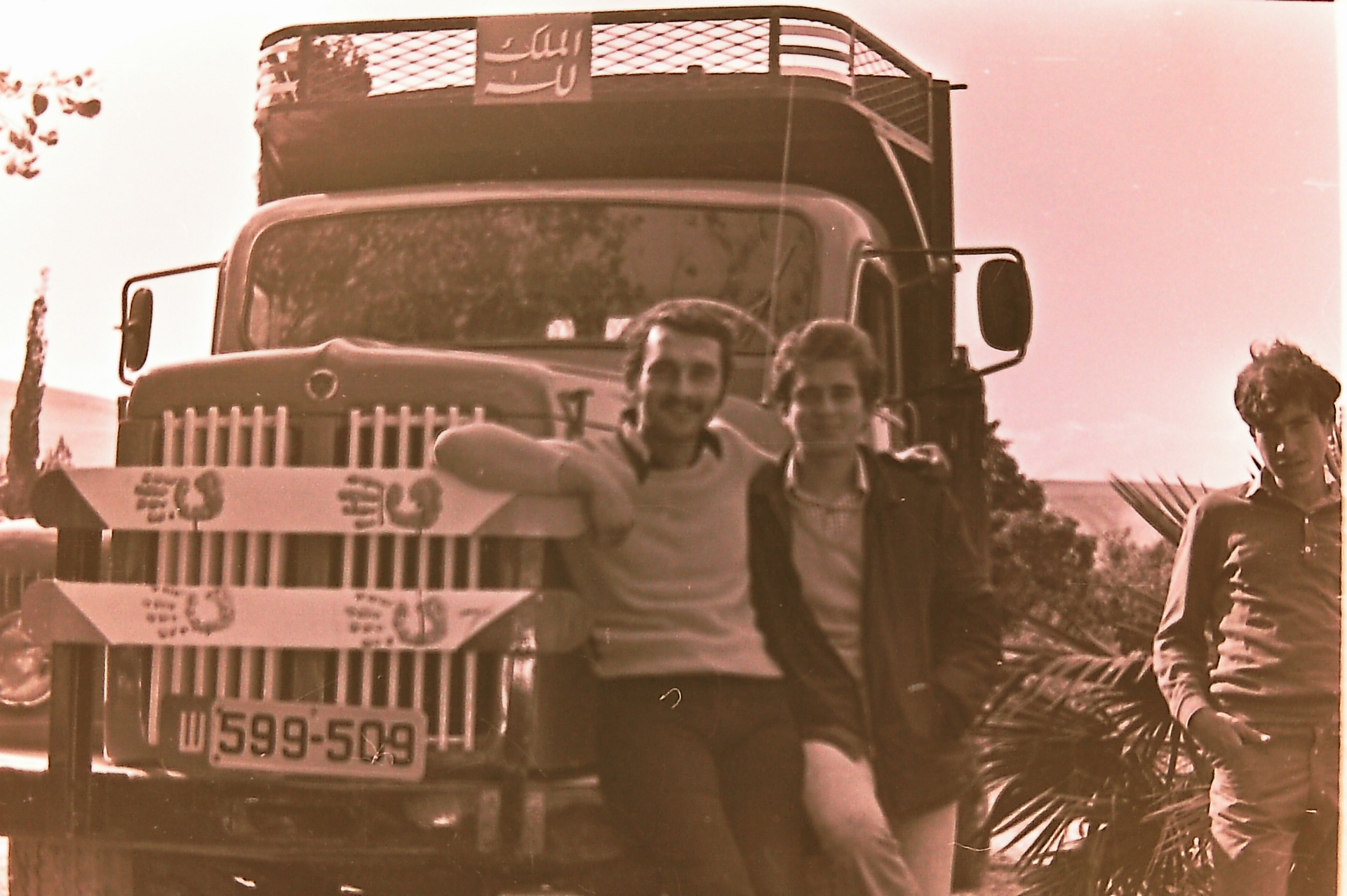 Samsam (left) and Saad (right) Al-Nimer leaning on the family truck — Fasayel, 1970s.