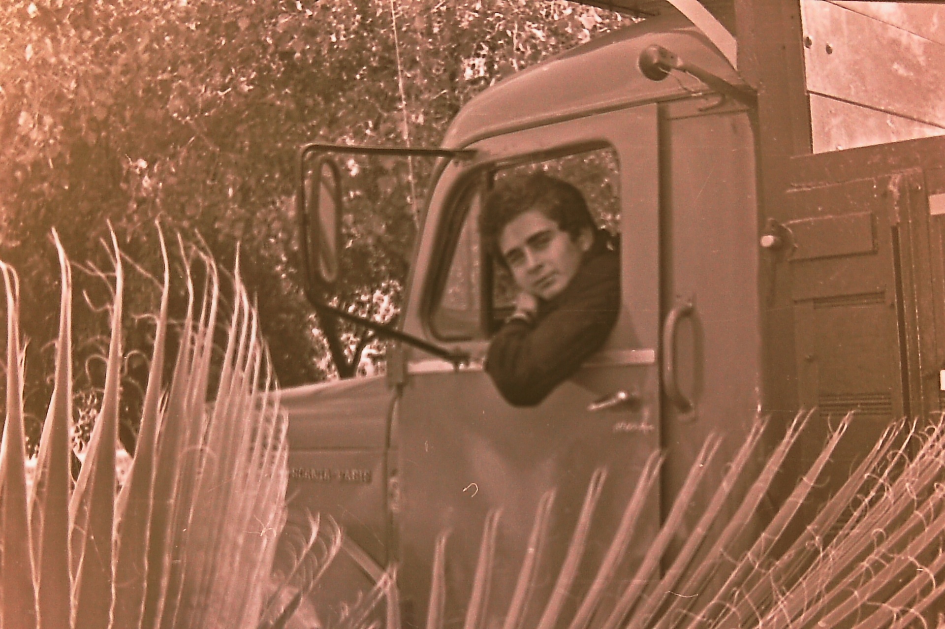 Saad Al-Nimer in the cab of the red Scania truck.