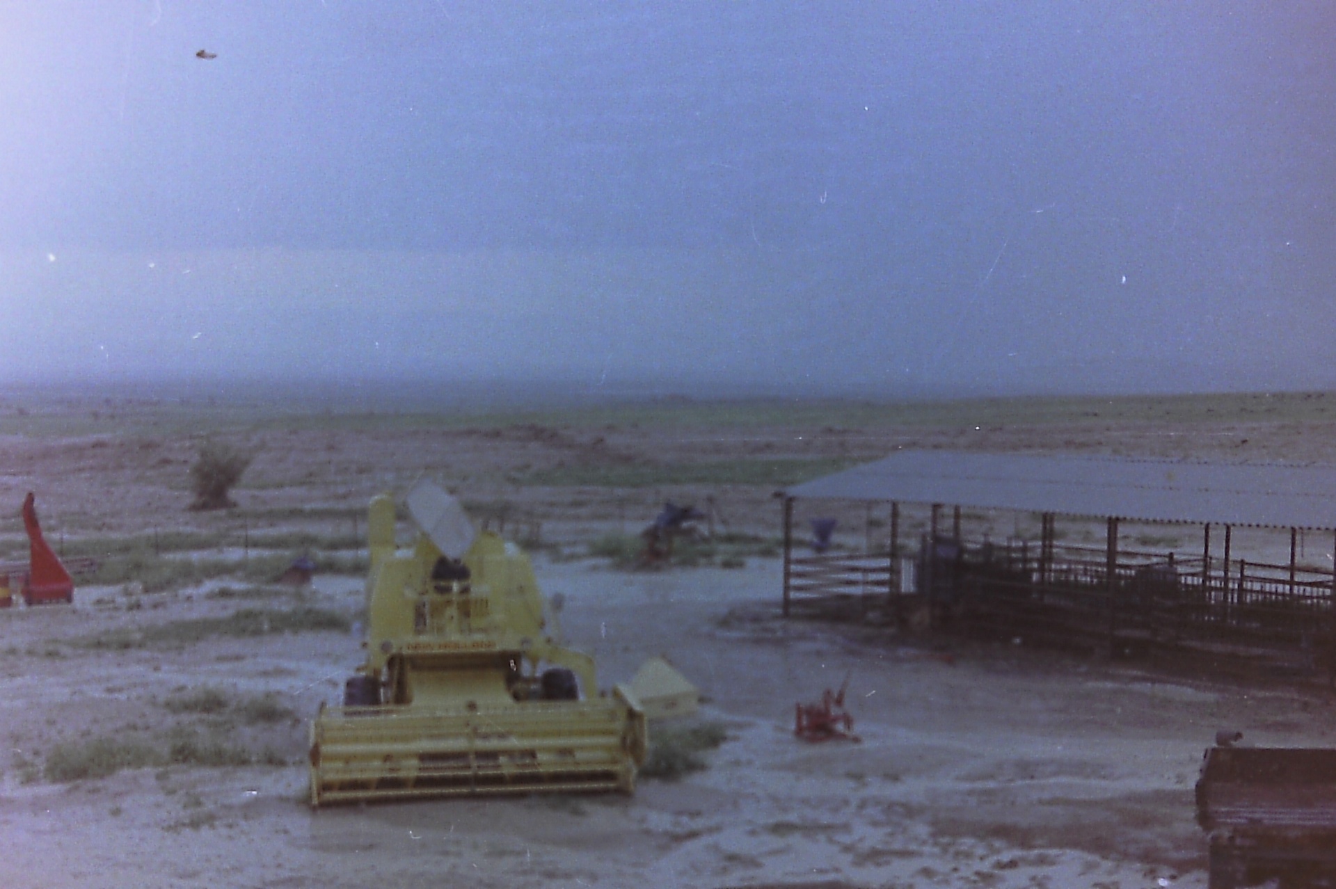 The New Holland combine parked in Fasayel — between harvests, 1960s–70s.