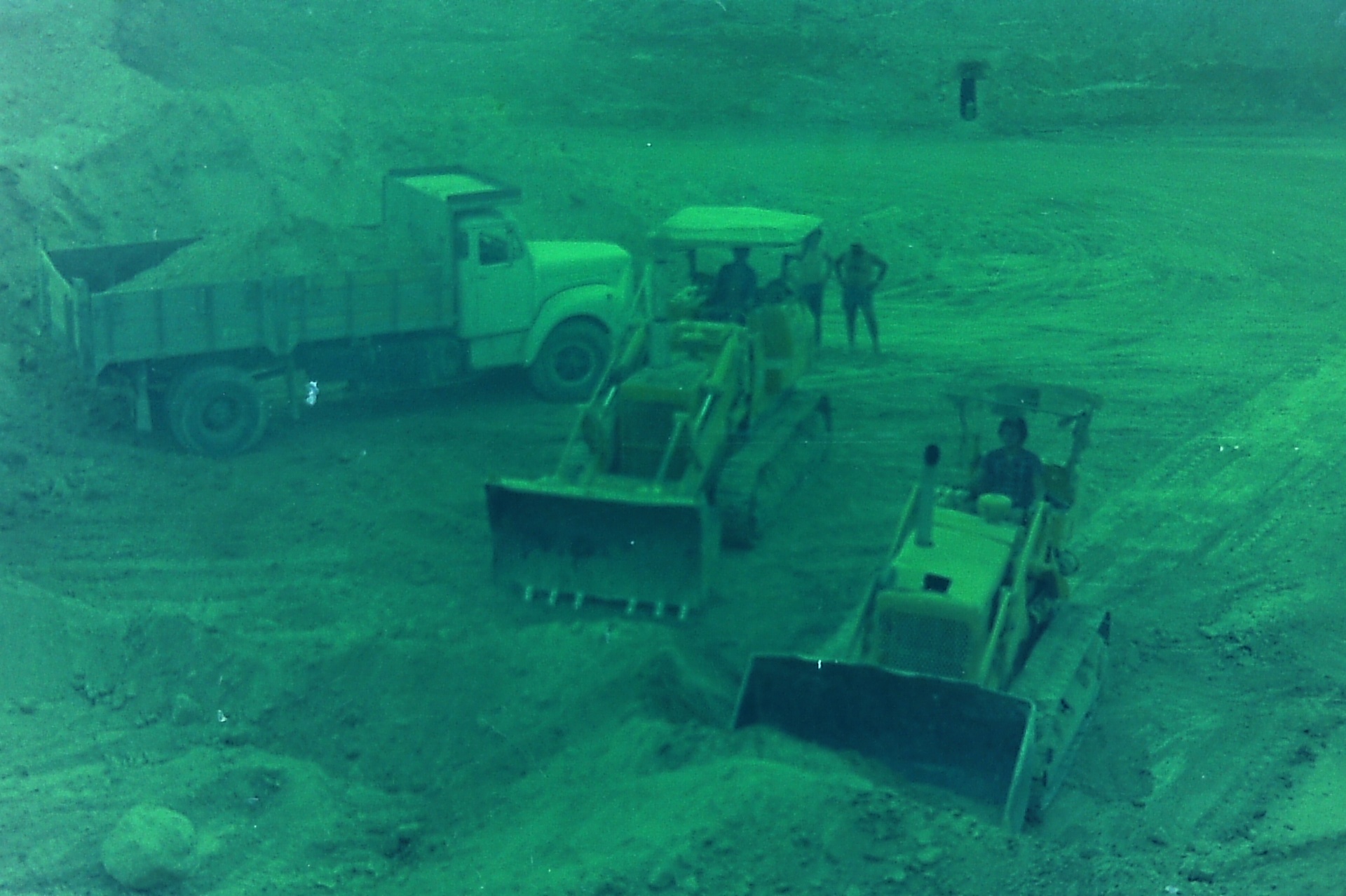 Excavating the Roman Pool — Saad (right) and Samsam (left) on the bulldozers, 1970s.