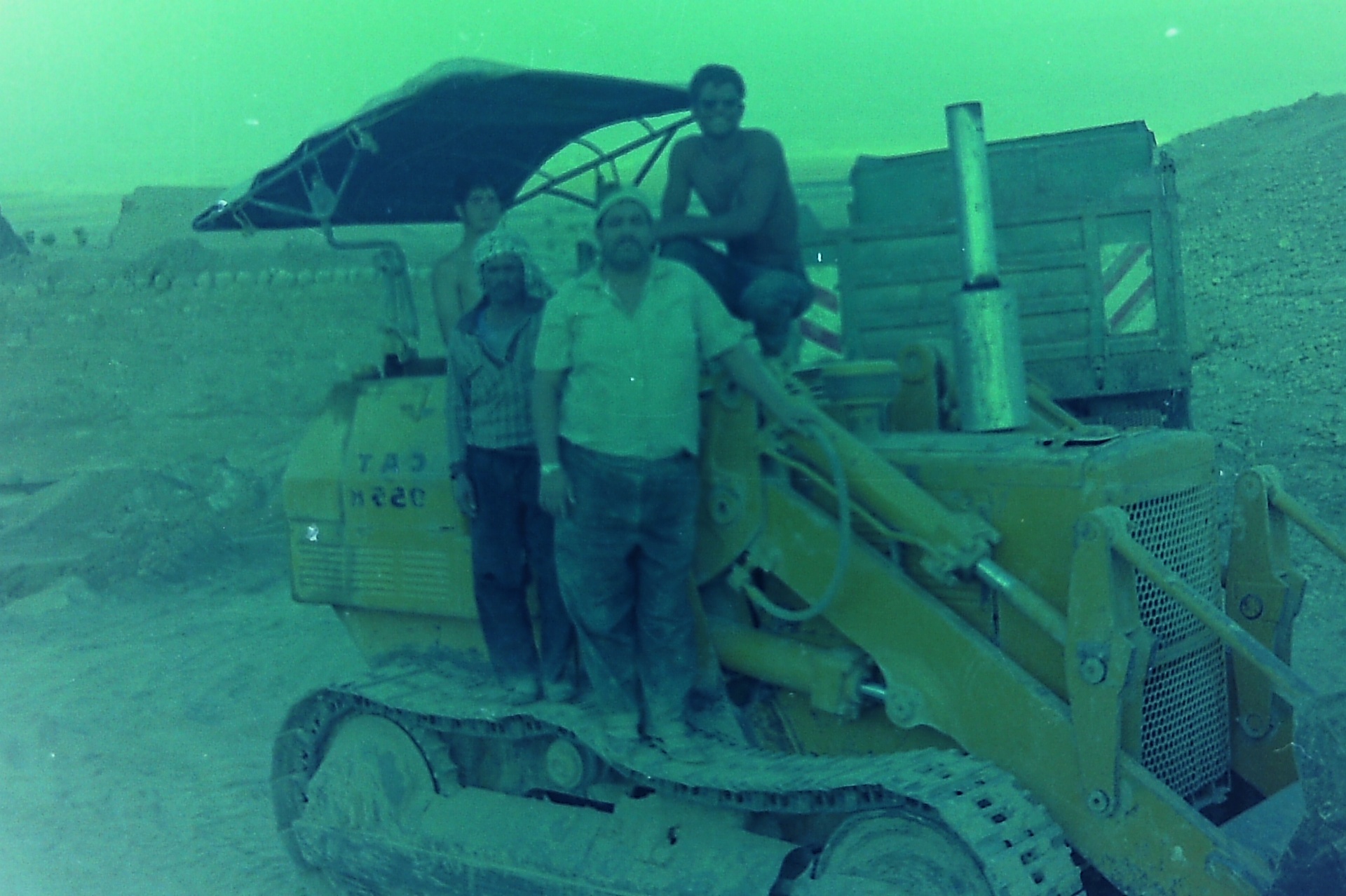 Workers on the CAT D5N bulldozer during the Roman Pool excavation.