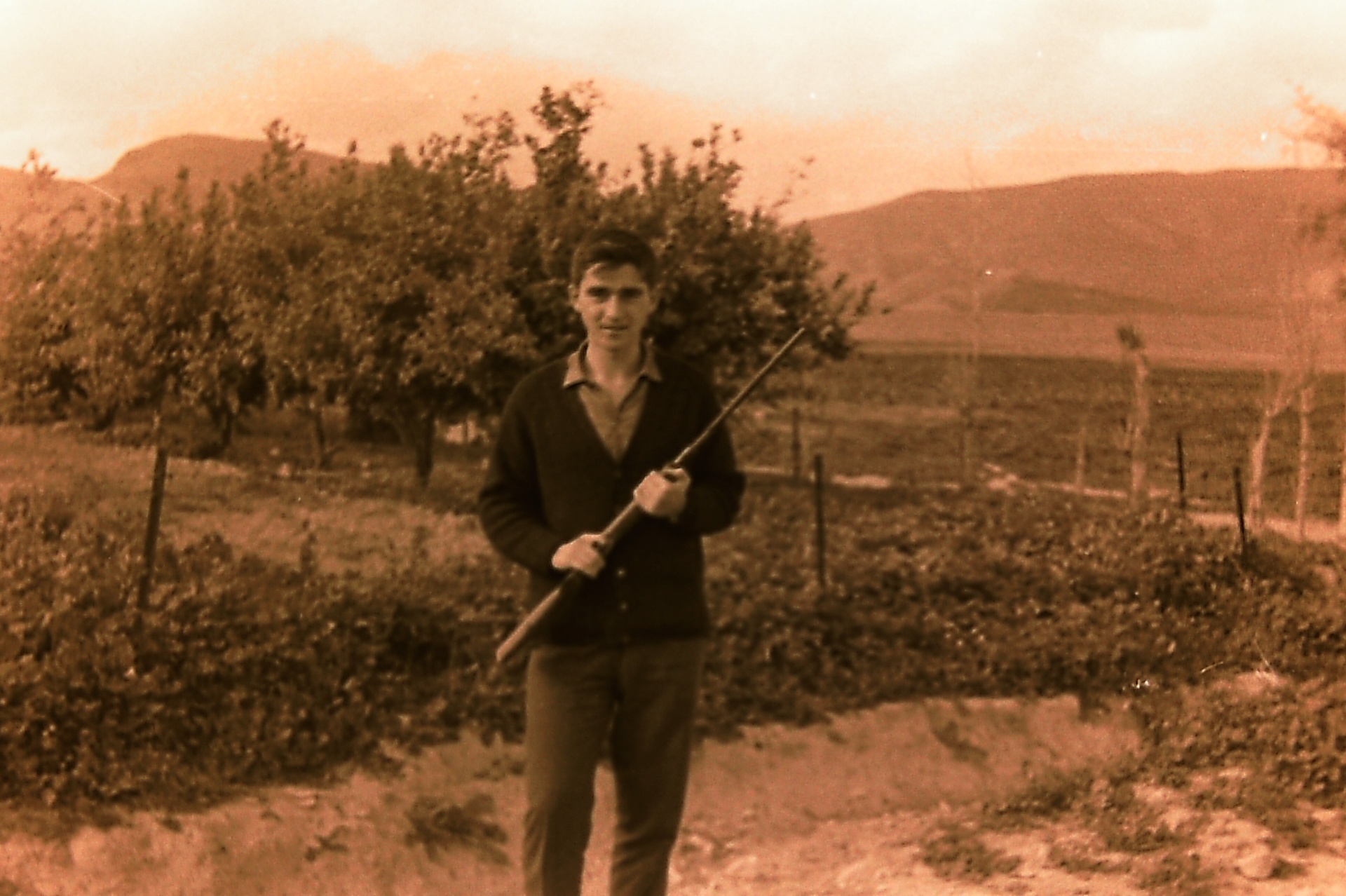 Silham Al-Nimer holding a hunting rifle in Fasayel — late 1950s.