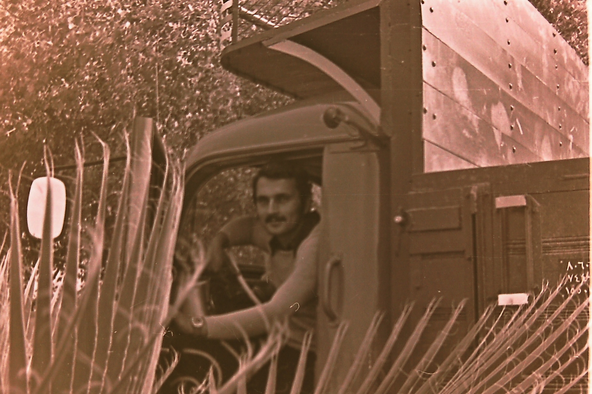 Samsam Al-Nimer in the cab of the farm's truck.