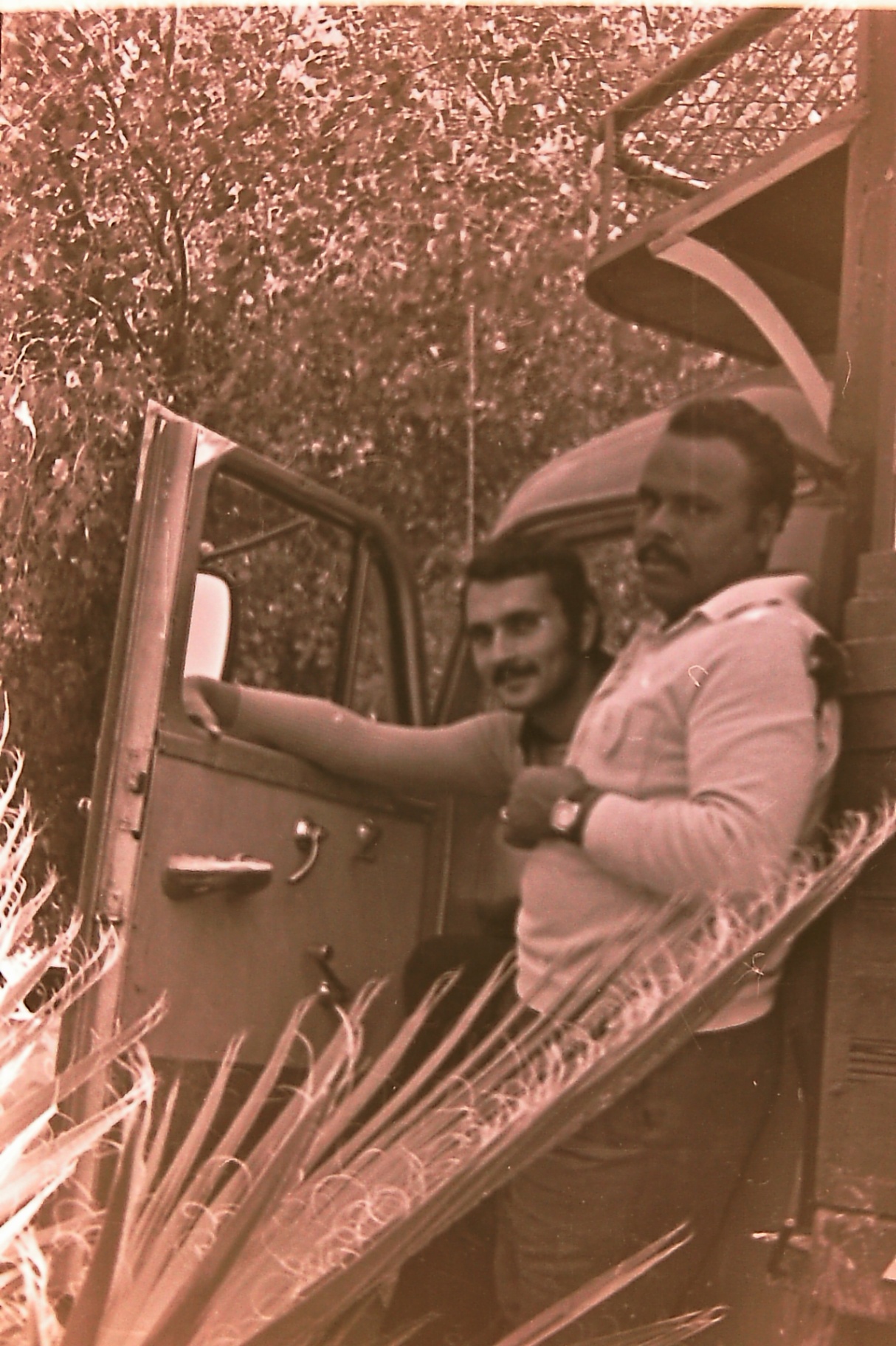 Samsam Al-Nimer (left) and Abu Khaled (right) at the truck door.