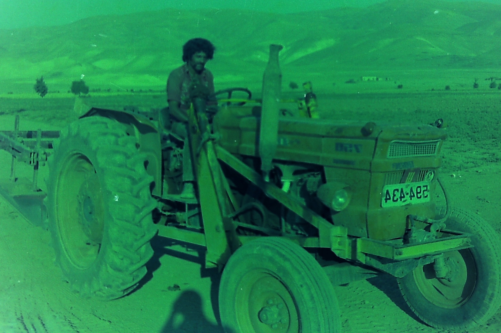 A worker on the tractor during the pipeline works in Fasayel.