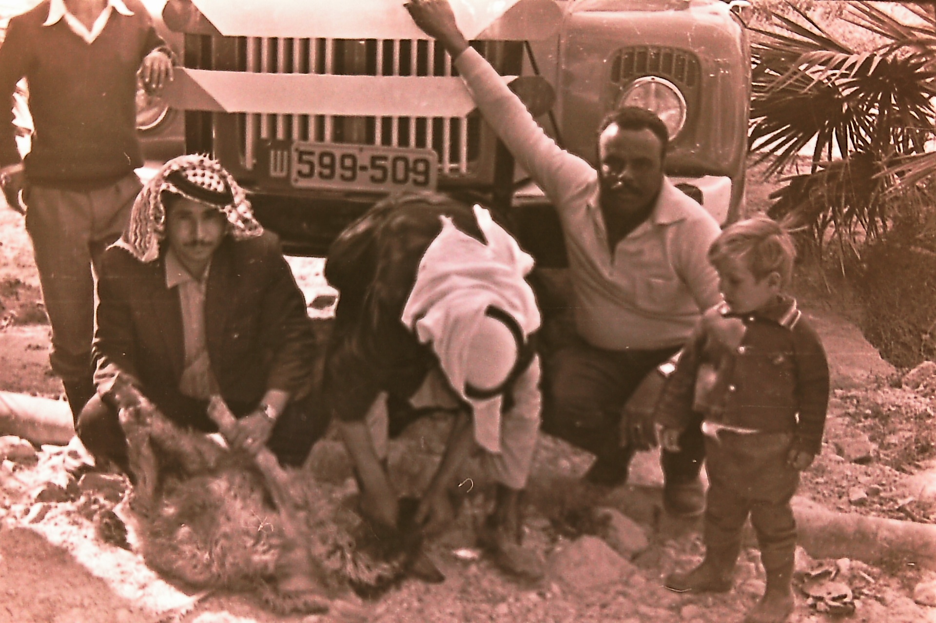 Abu Khaled (right) with farmers— closest of all to the family.