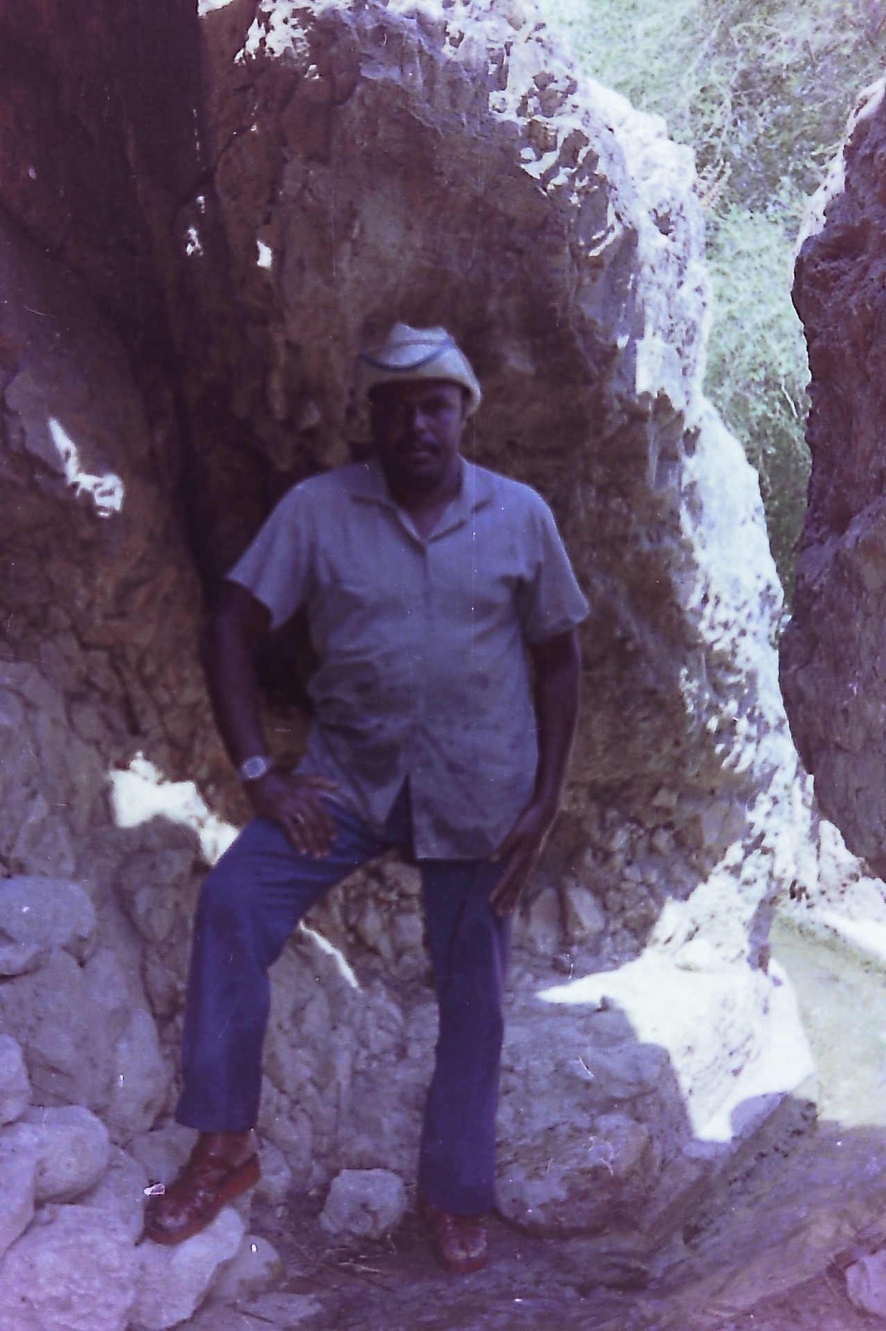 Standing in the cleared pool — eight meters of soil moved by hand.