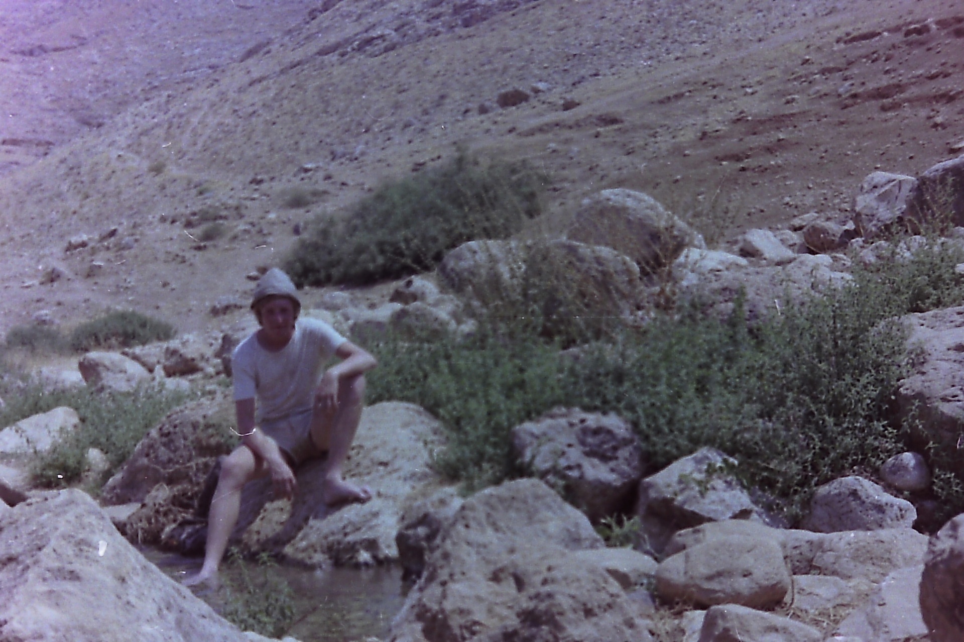 A European volunteer resting by the Ras Al-Ein spring, north of Fasayel.